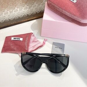 Miu Miu Black Sunglasses with Gold Accents